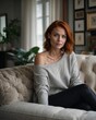 © KraPhoto - Confident Redhead Woman Posing on Elegant Sofa in Stylish, Modern Living Room Environment