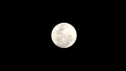 Wall Mural - full moon over black Full moon. Beautiful moon lights up the night. The moonlight filters through the clouds. A night illuminated by the moonlight. Craters of the moon