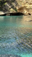 Wall Mural - Rocky coast of the sea, vertical video.