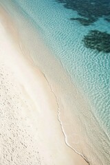  Tranquil beach setting with lounge chairs and umbrellas along a clear turquoise coastline