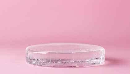 Round ice pedestal for product presentation on pink background. Pedestal in studio. Cool display.