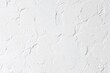 © Sebelas Studio - Close-up of a textured white wall surface.