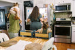 © Serena Burroughs/Stocksy - lgbtq mothers and children in kitchen at home