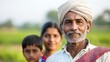 © top images - A farmer poses for a portrait with his family in a vibrant green field during the golden hour in rural India