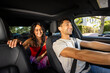 © McKinsey Jordan/Stocksy - Interior Wide Angle Car Shot Of A Rideshare Driver And Passenger