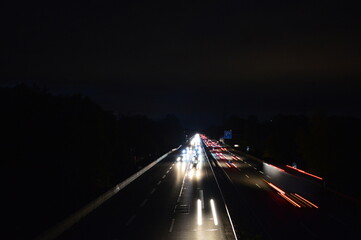 night highway with lights of passing cars