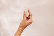 © Nicole Mason/Stocksy - Hand Holding A Small Pill