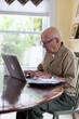 © Raymond Forbes LLC/Stocksy - Senior  computer  Veteran Medical benefits