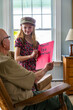 © Raymond Forbes LLC/Stocksy - Young Girl hands card thanking veteran tribute