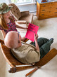 © Raymond Forbes LLC/Stocksy - Young Girl hands card portrait thanking veteran tribute overhead