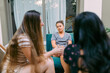 © Olly R/Stocksy - Best girl friends sitting and talking outside at the backyard patio