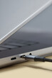 © Yaroslav Danylchenko/Stocksy - Close up type c cable getting plugged in silver laptop