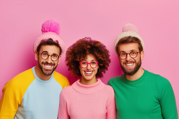 In a playful atmosphere, a dynamic team of two men and one woman showcases their creativity with bright hats and cheerful expressions, embodying artistic collaboration