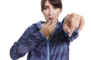 woman blowing whistle on white background, selective focus