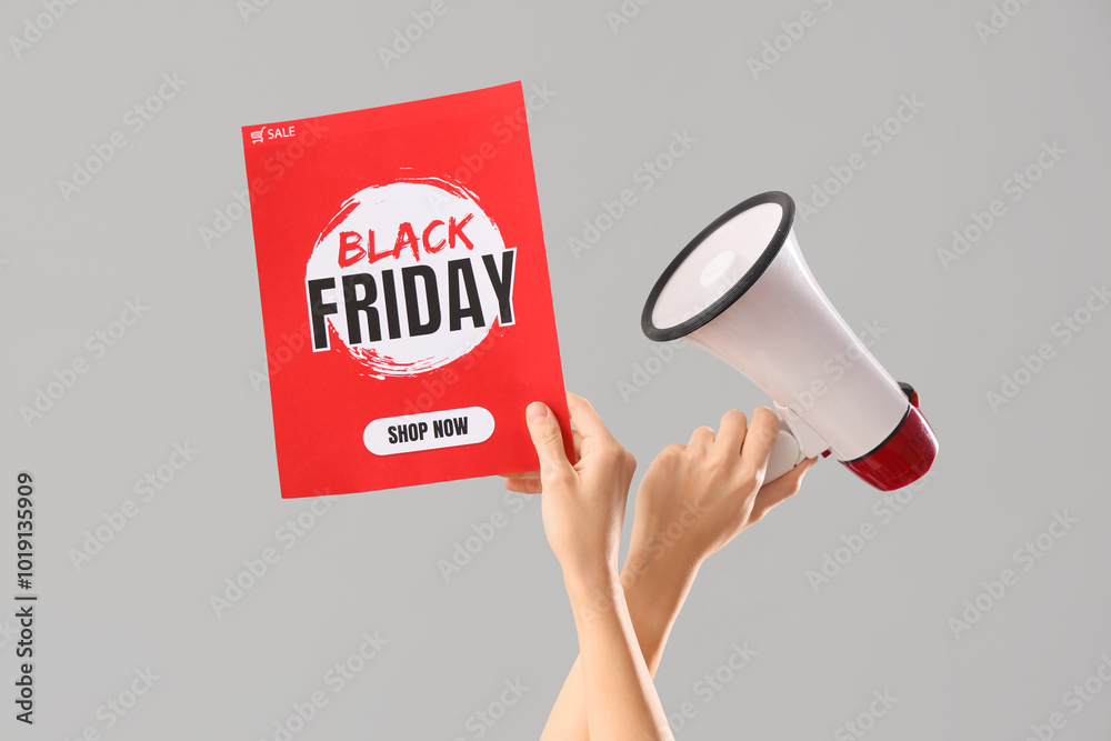 Female hands with megaphone and text BLACK FRIDAY SALE on grey background