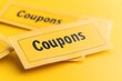 © Downloads - Floating coupons with an elegant font design in a vibrant color scheme of yellow white and black creating a dynamic and eye catching visual for discount sale and promotional content in the retail