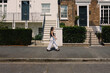 Female vacationer strolling through the streets of Camden Town