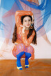© Tania Cervian/Stocksy - Beautiful woman sitting on haunches