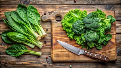 A rustic wooden cutting board showcasing a medley of fresh greens, including leafy greens, broccoli florets, and lettuce, accompanied by a gleaming knife, ready for culinary creation.