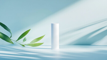 Poster - minimalist white tube stands elegantly against soft blue background, complemented by green leaves casting gentle shadows, creating serene and fresh atmosphere