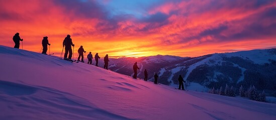 Poster - Silhouettes of skiers on a snowy mountaintop at sunrise with a vibrant pink and orange sky.