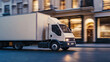 © Curva Design - Delivery truck in fast motion on city street. Fast moving cargo truck on urban road with copy space for black friday background banner.