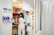 © Santi Nuñez/Stocksy - Medical staff working at nurse station