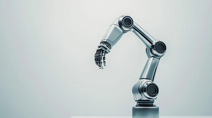 Poster - A silver robotic arm stands out against a white backdrop. Its mechanical hand, part of an industrial robot, represents the latest advancements in manufacturing technology.