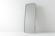 © Larisa - Tall full-length mirror in minimalistic room