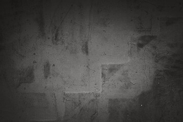 Wall Mural - A black and white photo of a wall with a grey background. The wall has a lot of cracks and he is old