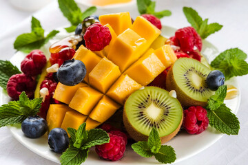 Poster - Bright and fresh fruit salad, expertly arranged on a snow-white background