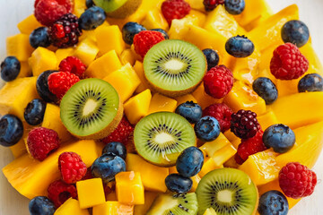 Poster - Fruit background. Bright and fresh fruit salad. Close-up