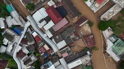 Wall Mural - Aerial view of the local village in the border of Thailand and Myanmar having damaged after flooded by Sai river.