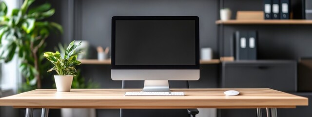 Modern office interior with a wooden desk and a computer on it, close-up of the table in front view