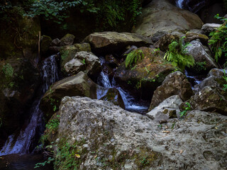 Large boulders in a stream. Mountain river.  Water flow