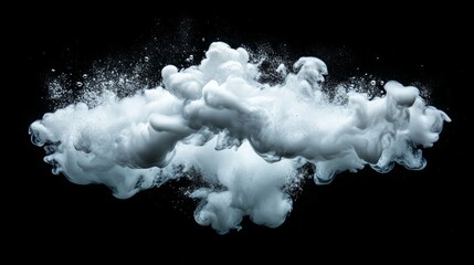 Abstract white cloud of ink in water against a black background.