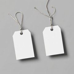 White blank price tag mockup hanging on a strings, front view, flat lay, isolated, on a light background with a lot of blank space as a placeholder for any text or logo