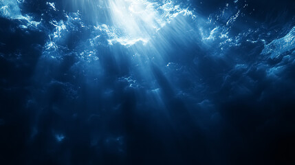 Wall Mural - abstract image of tropical underwater dark blue deep ocean wide nature background with rays of sunli