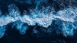 Aerial View of Ocean Waves: A top-down view of ocean waves, highlighting the patterns and movement of the sea from above.