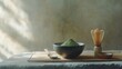© 69 - A beautiful matcha tea setup with a bowl, wooden spoon, and fine green tea powder, showcasing the artistry of Japanese tea ceremonies