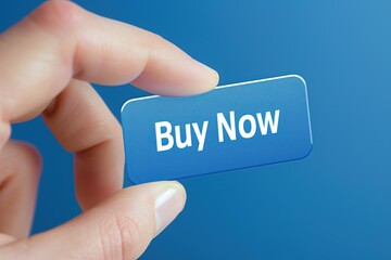 Hand holding a transparent button that says 'Buy Now' on a blue background.