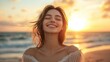 © CinimaticWorks - smiling woman with open arms embracing the sunset on the seashore, backlit by the golden light as she enjoys a serene and peaceful moment with closed eyes and a calm expression