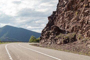 Mountain asphalt road going around a bend