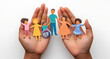 © Ignats - Hands Holding a Paper Cutout of a Family Representing Care, Inclusion, and Diversity