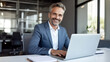© halo - businessman working on laptop in office