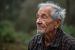 © Hannes - Portrait of thoughtful elderly man with gray hair and beard outdoors in nature