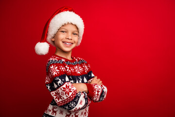 Sticker - Photo portrait of cute little boy crossed hands confident celebrate new year wear knitted outfit isolated on red color background