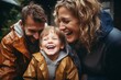 © Vorda Berge - Portrait of a family smiling in front of house while raining