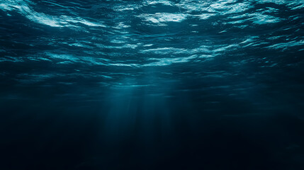 Wall Mural - dark blue ocean surface seen from underwater: an underwater view of the ocean surface with a dark bl