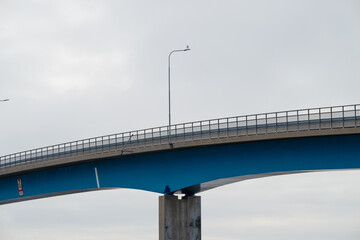 Wall Mural - Roadway of a bridge between islands.